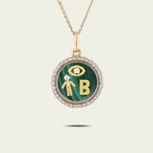 Médaillon serti de diamants initiale, garçon perle & oeil